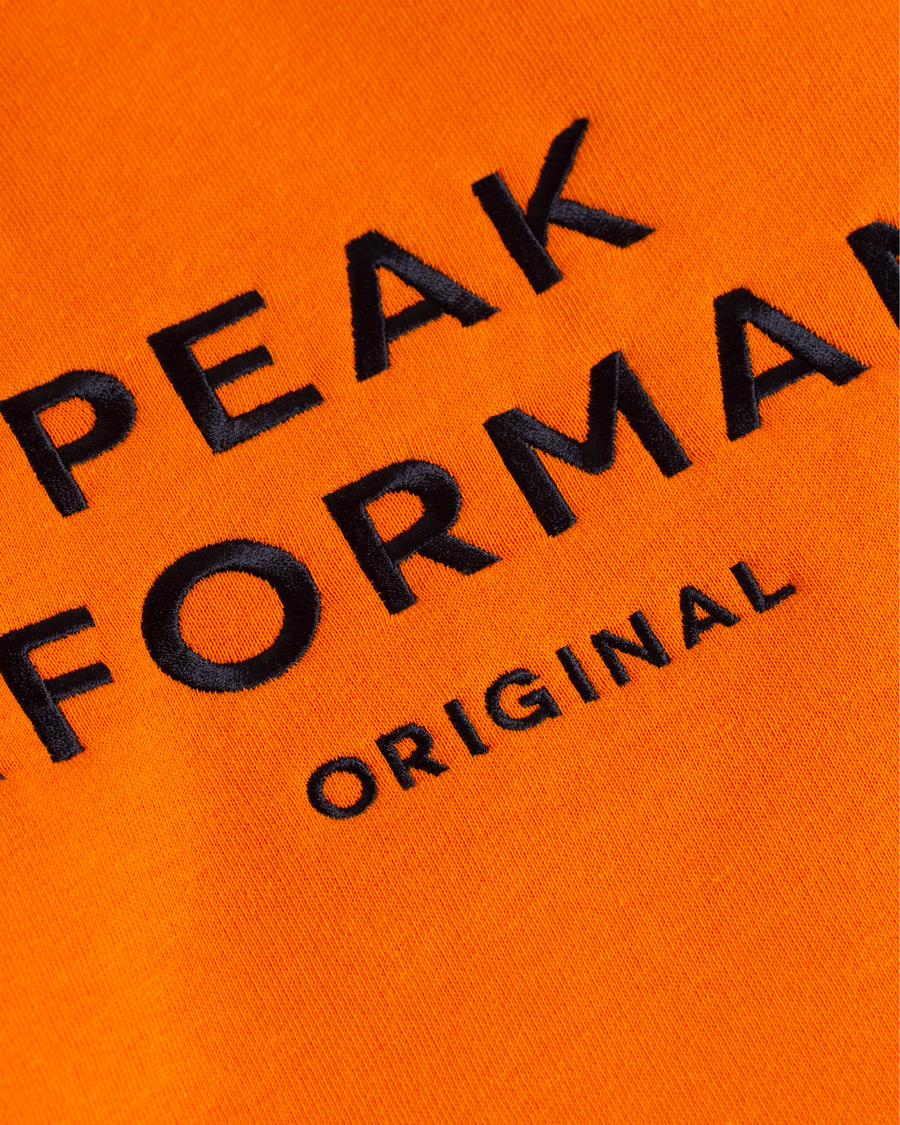 Mies | Puserot | Peak Performance | Logo Hoodie Orange