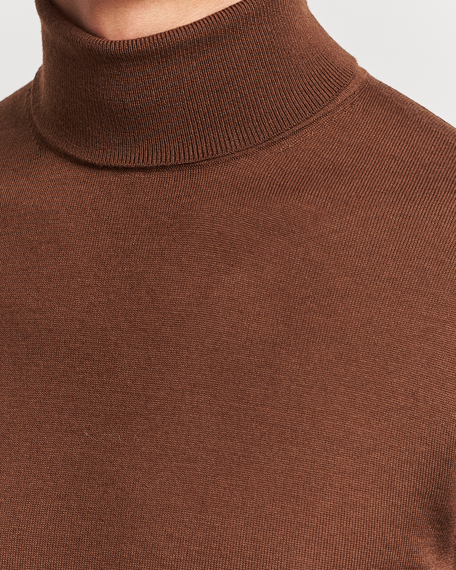 Mies | Puserot | Tiger of Sweden | Nevile Extra Fine Merino Polo Golden Copper