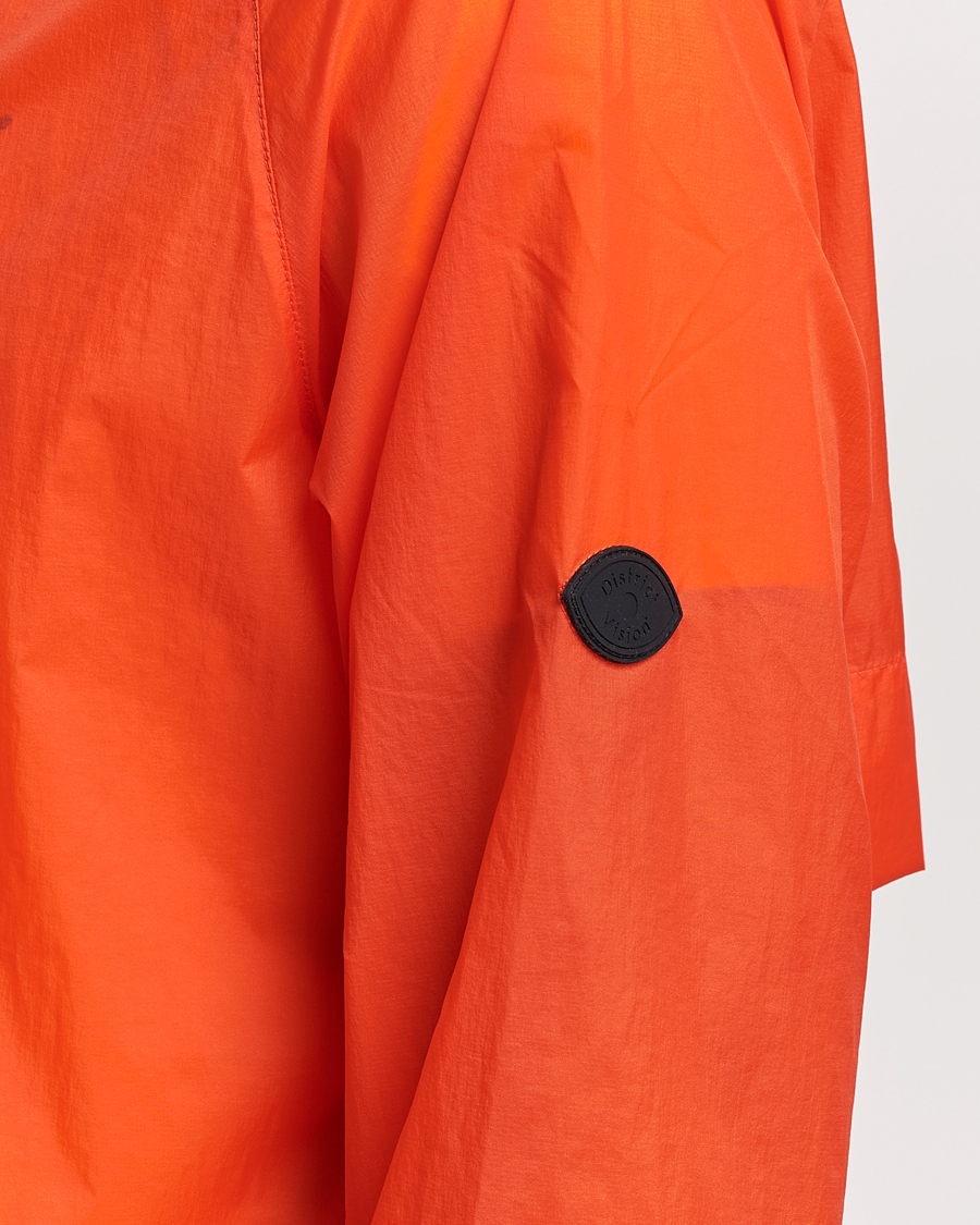 Mies | Takit | District Vision | Ultralight Packable DWR Wind Jacket Tangerine