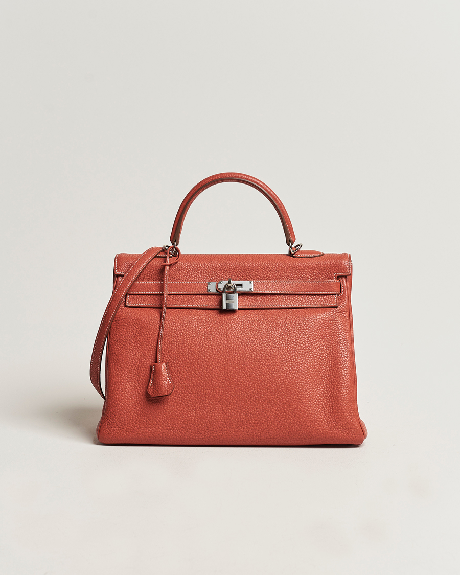 Mies | Hermès Pre-Owned Kelly 35 Handbag Taurillion Clemence Orange | Hermès Pre-Owned | Kelly 35 Handbag Taurillion Clemence Orange