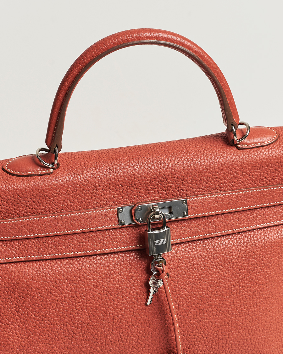 Mies | Hermès Pre-Owned Kelly 35 Handbag Taurillion Clemence Orange | Hermès Pre-Owned | Kelly 35 Handbag Taurillion Clemence Orange