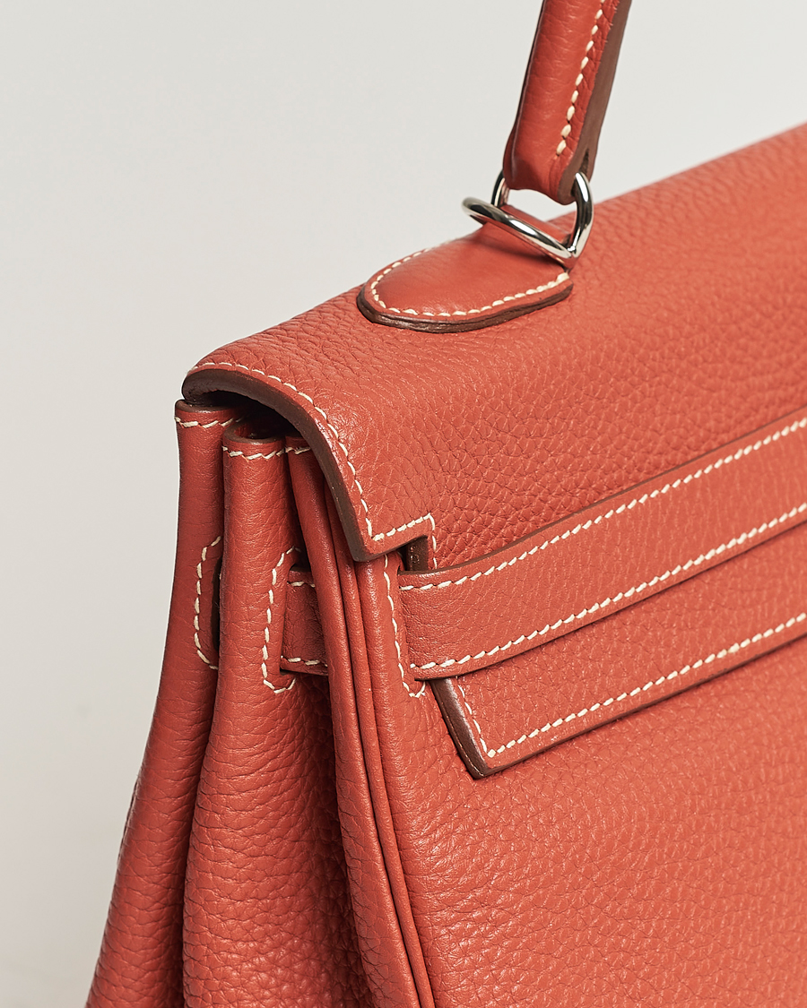 Mies | Hermès Pre-Owned Kelly 35 Handbag Taurillion Clemence Orange | Hermès Pre-Owned | Kelly 35 Handbag Taurillion Clemence Orange