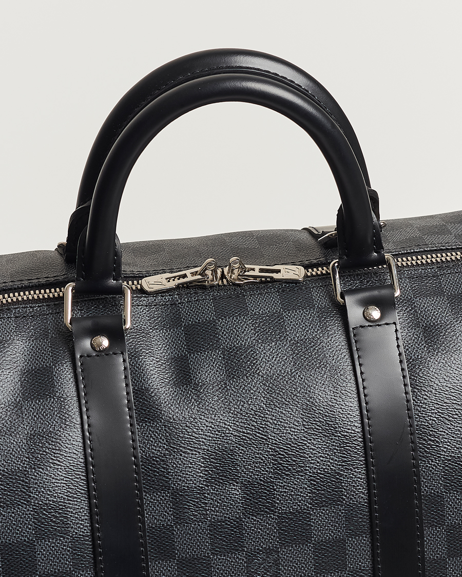 Mies | Louis Vuitton Pre-Owned Keepall Bandoulière 55 Damier Graphite | Louis Vuitton Pre-Owned | Keepall Bandoulière 55 Damier Graphite