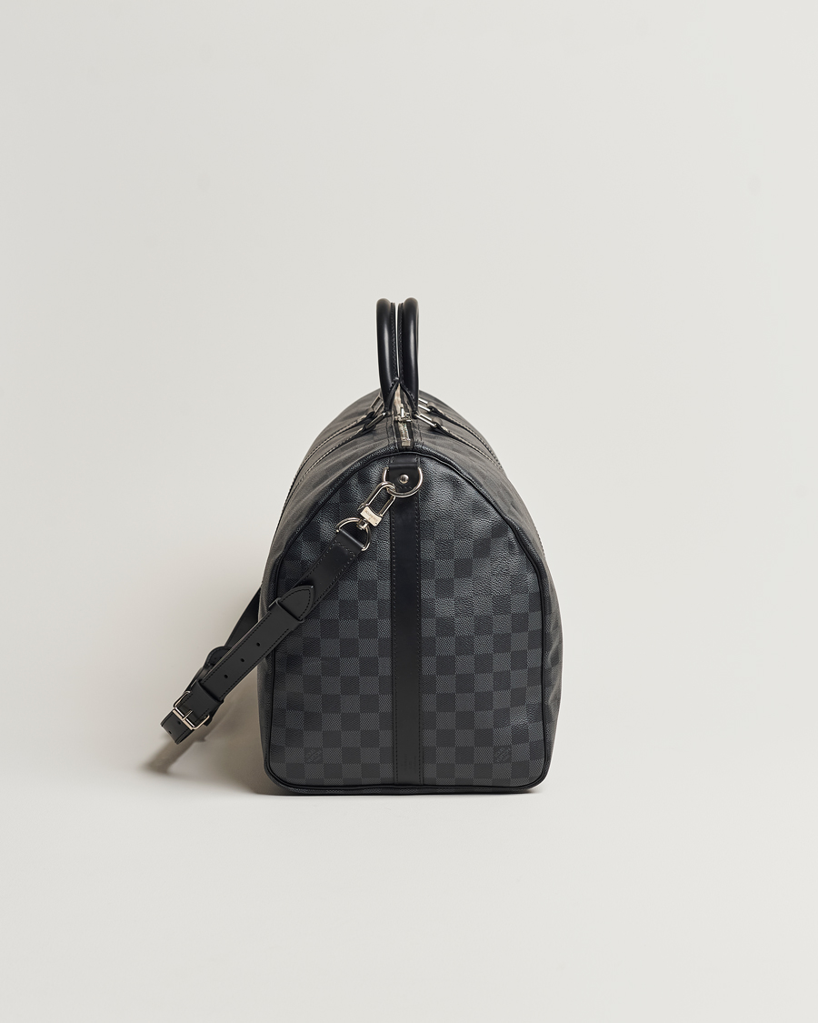 Mies | Louis Vuitton Pre-Owned Keepall Bandoulière 55 Damier Graphite | Louis Vuitton Pre-Owned | Keepall Bandoulière 55 Damier Graphite