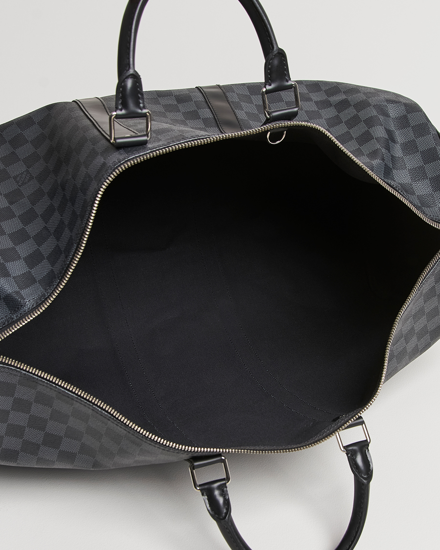 Mies | Louis Vuitton Pre-Owned Keepall Bandoulière 55 Damier Graphite | Louis Vuitton Pre-Owned | Keepall Bandoulière 55 Damier Graphite