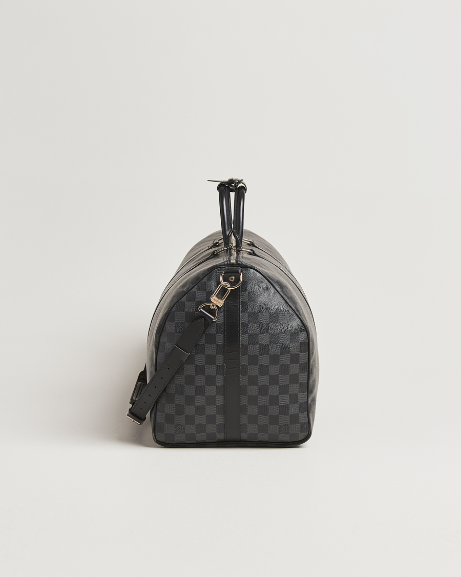 Mies | Louis Vuitton Pre-Owned Keepall Bandoulière 55 Damier Graphite | Louis Vuitton Pre-Owned | Keepall Bandoulière 55 Damier Graphite