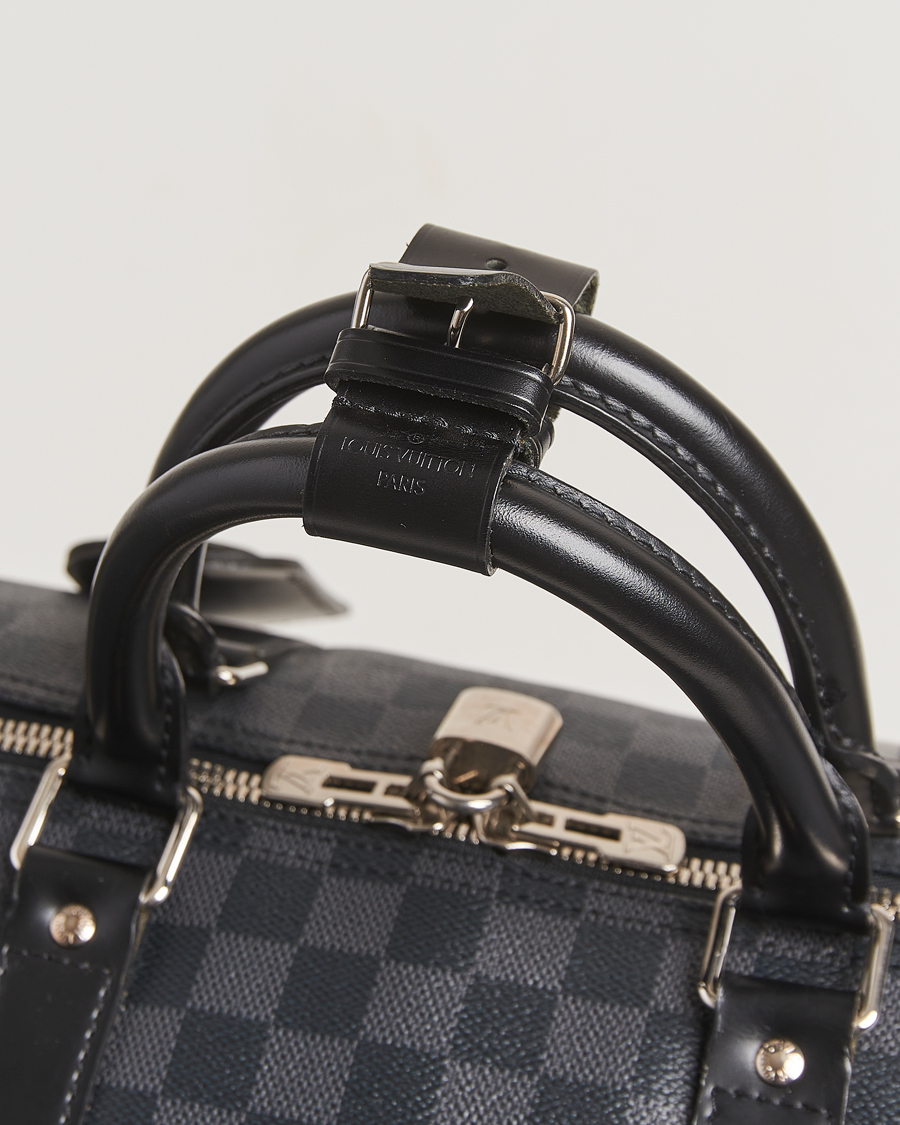 Mies | Louis Vuitton Pre-Owned Keepall Bandoulière 55 Damier Graphite | Louis Vuitton Pre-Owned | Keepall Bandoulière 55 Damier Graphite