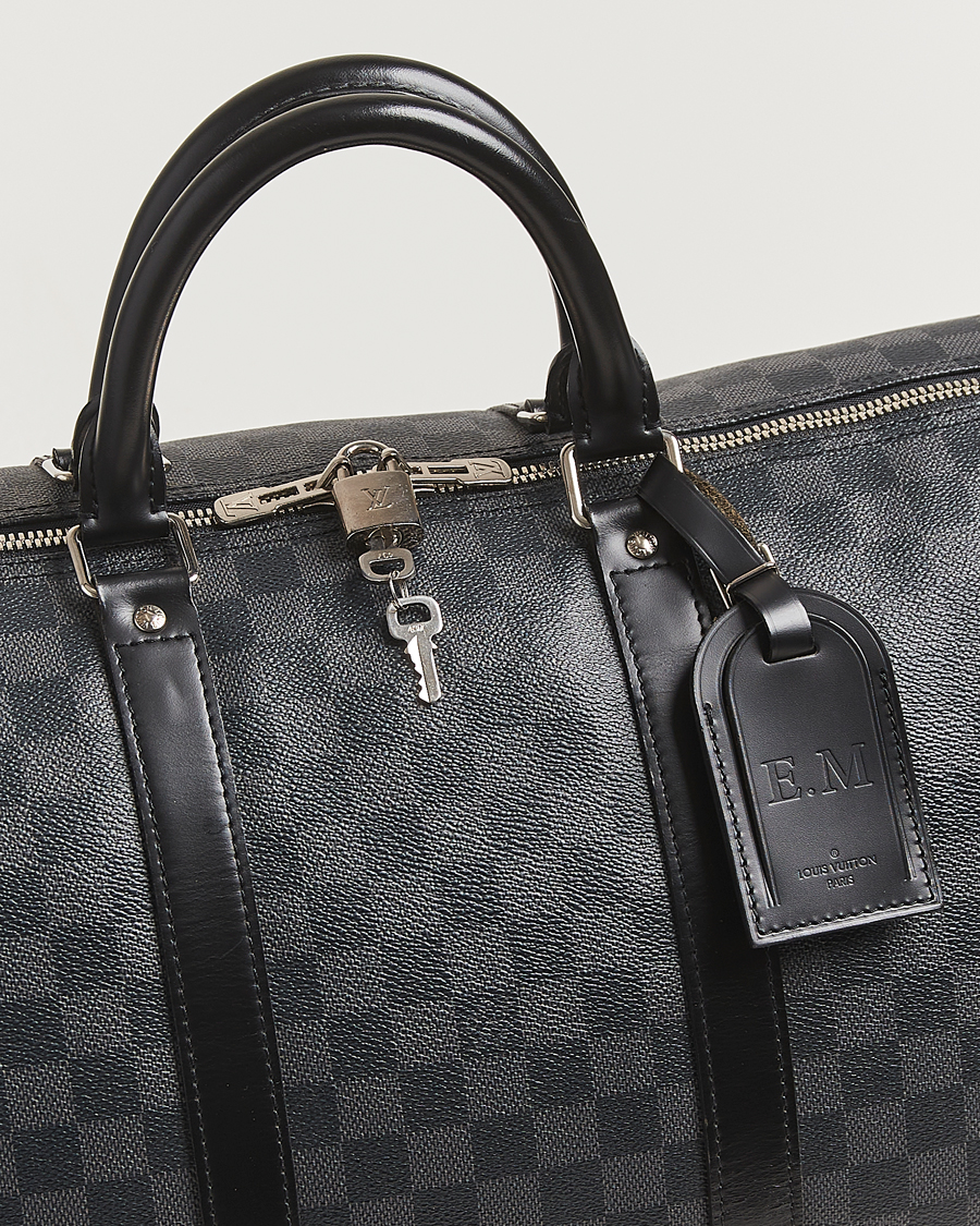 Mies | Louis Vuitton Pre-Owned Keepall Bandoulière 55 Damier Graphite | Louis Vuitton Pre-Owned | Keepall Bandoulière 55 Damier Graphite