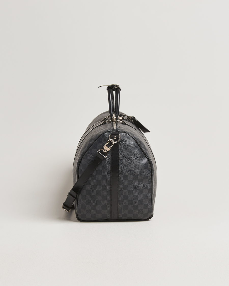 Mies | Louis Vuitton Pre-Owned Keepall Bandoulière 55 Damier Graphite | Louis Vuitton Pre-Owned | Keepall Bandoulière 55 Damier Graphite